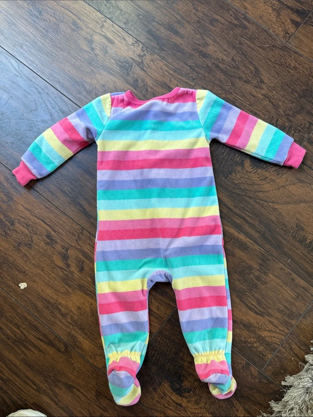 Pink striped pajama onesie with unicorn rainbow